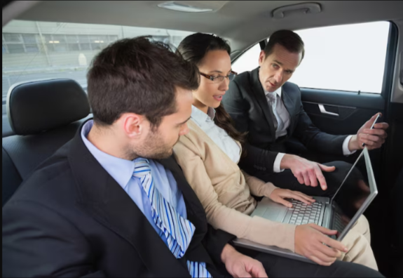 Three business travellers meeting in car