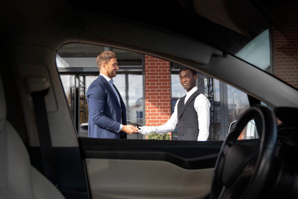A chauffuer hand shake to business taveler for join corporate transporation in ras al khaimah
